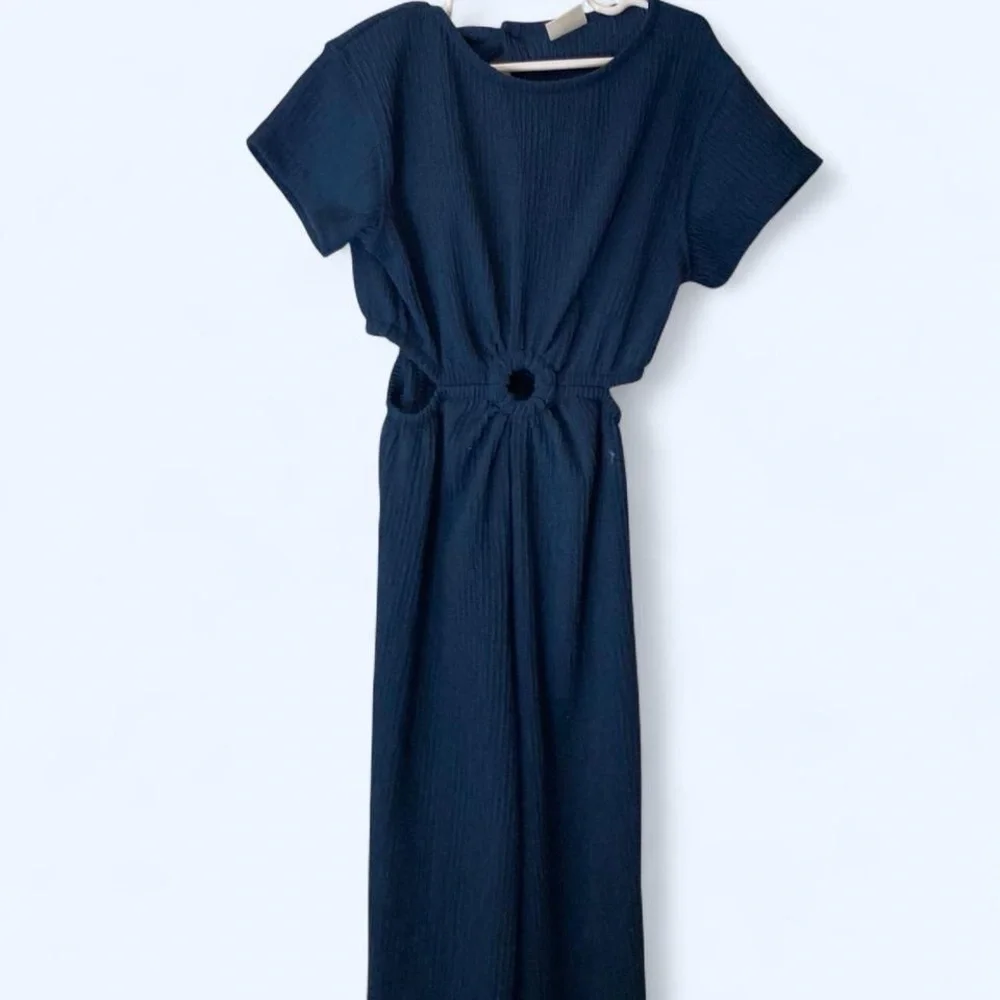 Navy blue jumpsuit with keyhole middle and open sides back slit as well girls 9